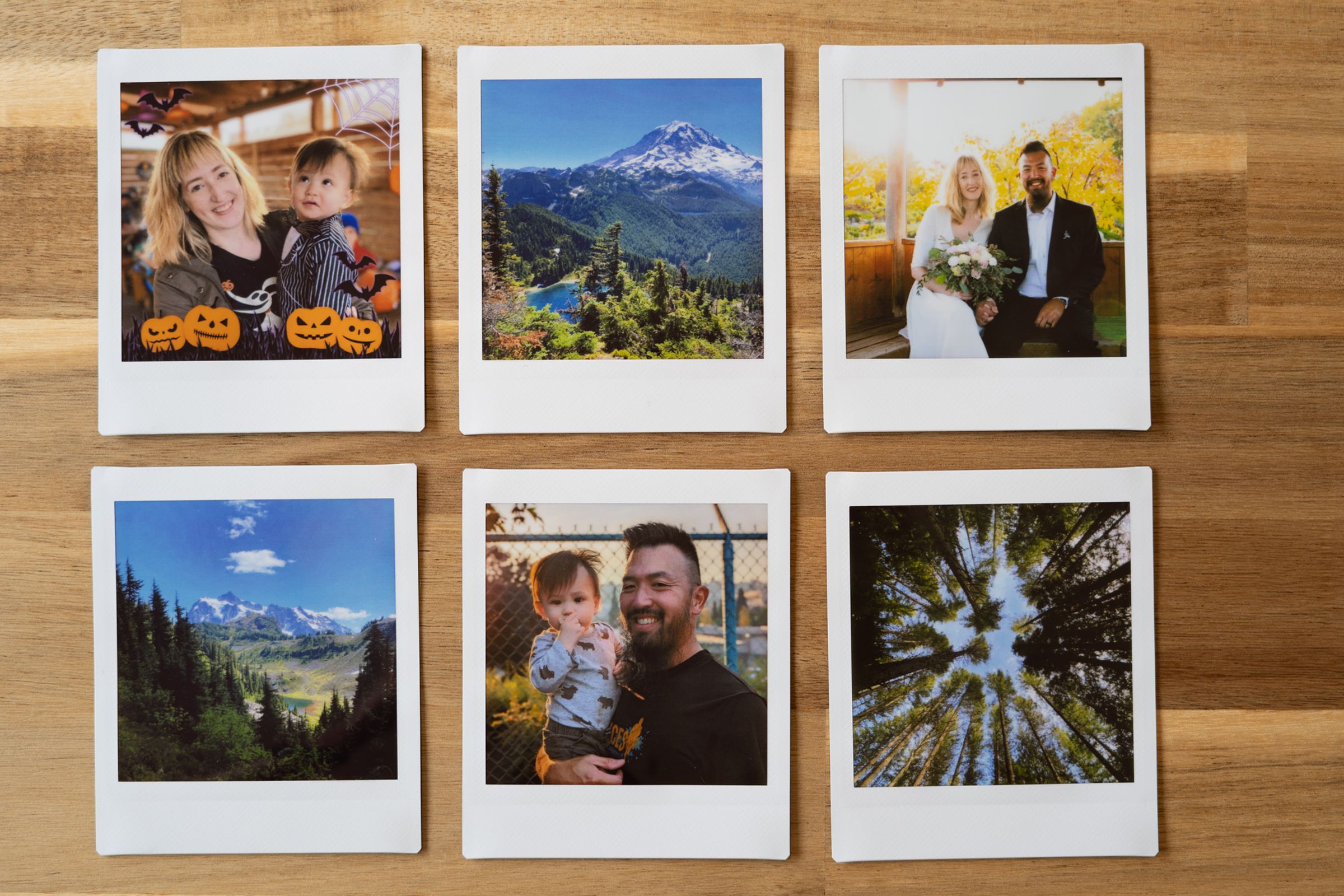Six Instax square prints on a table.