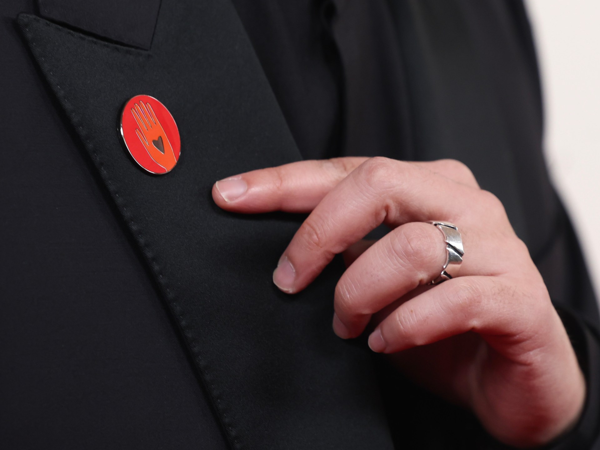 Celebrities at Oscars wear red pins to support Gaza ceasefire calls