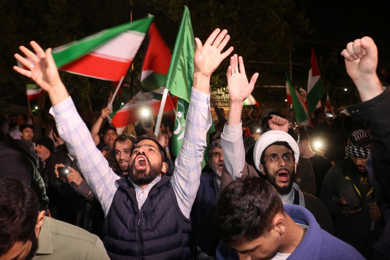 Iranian demonstrators react after the IRGC attack on Israel, during an anti-Israeli gathering in front of the British Embassy in Tehran, Iran, April 14