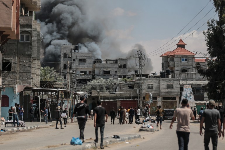 RAFAH, GAZA - MAY 07: RAFAH, GAZA - MAY 07: Smoke rises from shopping center following Israeli airstrike on east of Rafah