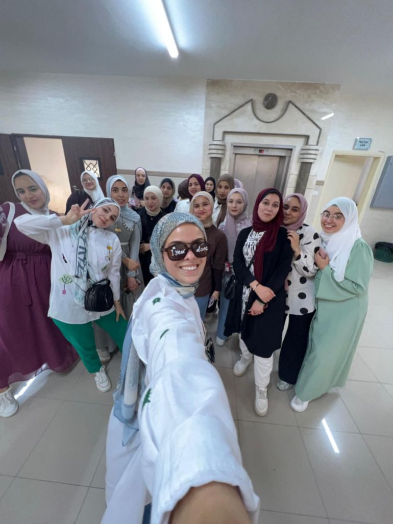 Zahra al-Kurd [front] takes selfie with her classmates at Al-Azhar University.