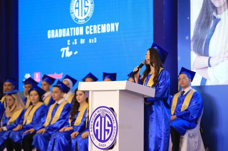 Tia al-Qudwa gives a speech at her high-school graduation in 2023.